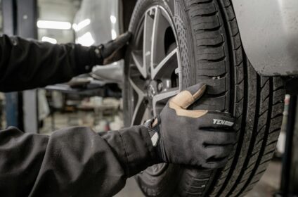 Mechanic changing tires in a garage