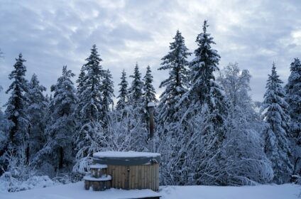 Outdoor hot bath at a Nordic spa in winter